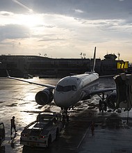 A plane sits on the tarmac at LaGuardia Airport in New York.
Mandatory Credit:	Angus Mordant/Bloomberg/Getty Images via CNN Newsource