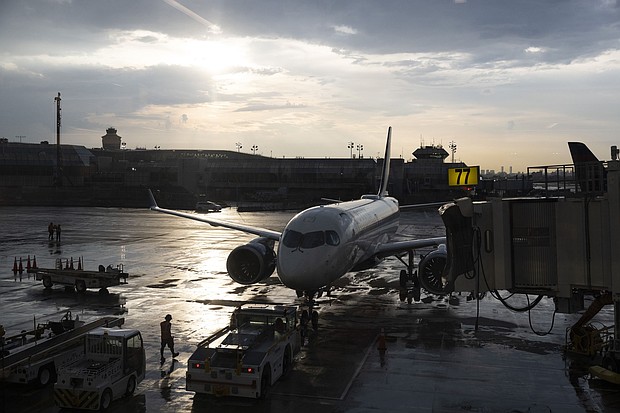 A plane sits on the tarmac at LaGuardia Airport in New York.
Mandatory Credit:	Angus Mordant/Bloomberg/Getty Images via CNN Newsource