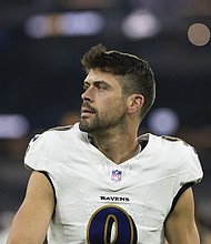 Justin Tucker walks back to the locker room after the Baltimore Ravens' game against the Los Angeles Chargers in November 2024.
Mandatory Credit:	Kyusung Gong/AP via CNN Newsource