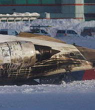 Emergency responders work after a plane crash at Toronto Pearson International Airport in Mississauga, Ontario, Monday.
Mandatory Credit:	Cole Burston/Reuters via CNN Newsource