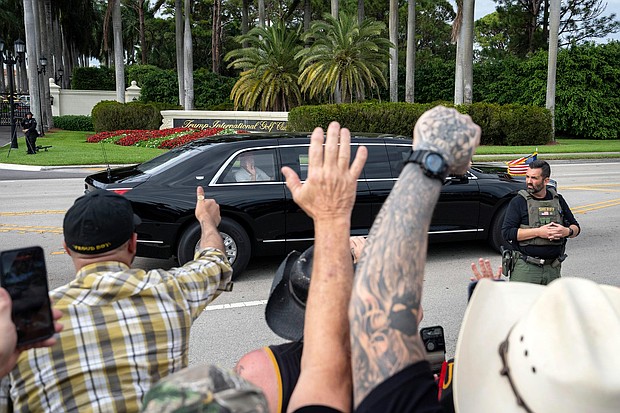 President Donald Trump waves to supporters as he leaves the Trump International Golf Club on February 17 in West Palm Beach, Florida.
Mandatory Credit:	Ben Curtis/AP via CNN Newsource