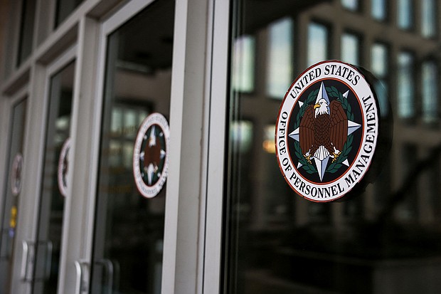 A view shows logos of the Office of Personnel Management in Washington, DC, after probationary staff at the OPM were fired in a conference call on February 13.
Mandatory Credit:	Tierney L. Cross/Reuters via CNN Newsource