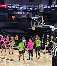 Representatives in the Virginia House and Senate compete in the 17th Annual Capitol Square Basketball Classic. Delegates are in pink and senators in green.