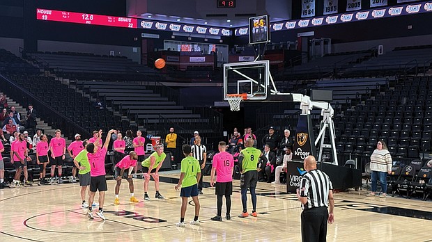 Representatives in the Virginia House and Senate compete in the 17th Annual Capitol Square Basketball Classic. Delegates are in pink and senators in green.