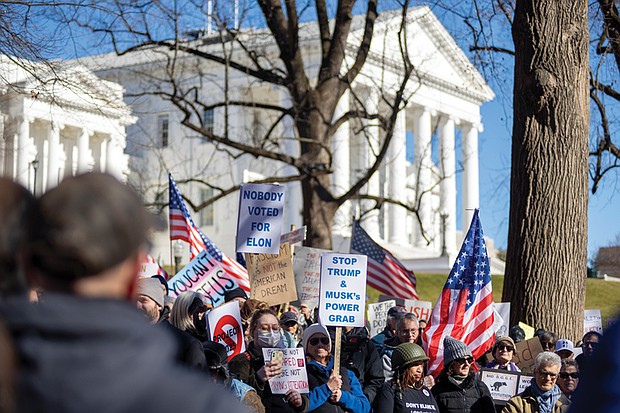 Hundreds of demonstrators gathered at the Bell Tower in Capitol Square on Presidents Day, Feb. 17, as part of the nationwide movement “50 Protests, 50 States, 1 Day,” opposing the policies of President Trump’s administration.