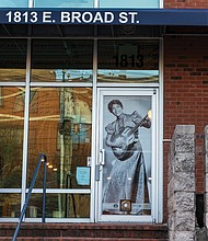 Image of Sister Rosetta Tharpe, Rock and Roll Hall of Fame member and former Barton Heights
resident, in the window of Shockoe Media. The photo is one of 20 large-scale historic images
displayed in windows throughout Shockoe Bottom as part of the public art project “Portals,”
which celebrates the legacy, resilience and everyday lives of Black Richmonders from the early
1800s to the 1980s.