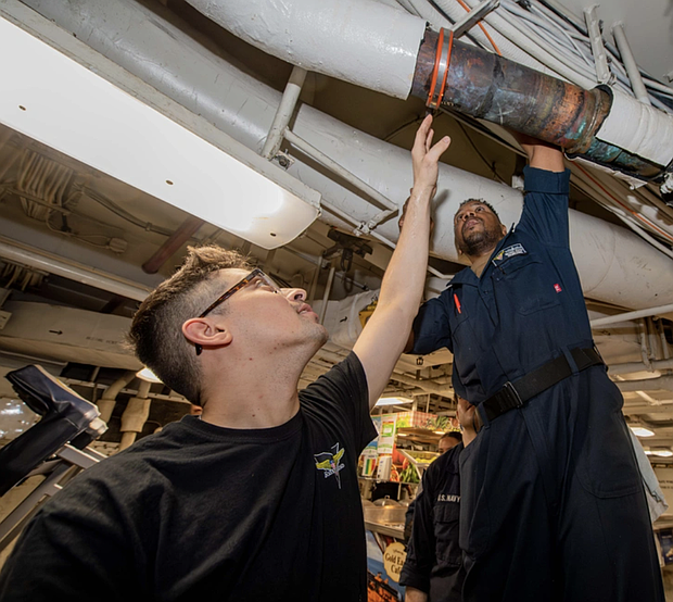 Fireman Grant Dailey, left, of Tomball, Texas, and Machinist Mate 1st Class Michael Ester, of Chicago, PHILIPPINE SEA
02.14.2025
Photo by Seaman Recruit Pablo Chavez 
USS Carl Vinson