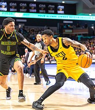 VCU's Zeb Jackson (2) gets past George Mason's K. D. Johnson (0) as the VCU Rams defeat the George Mason Patriots (70-54) at the Siegel Center Saturday, Feb. 22, 2025.  (photo by James Haskins)