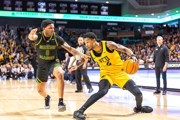 VCU's Zeb Jackson (2) gets past George Mason's K. D. Johnson (0) as the VCU Rams defeat the George Mason Patriots (70-54) at the Siegel Center Saturday, Feb. 22, 2025.  (photo by James Haskins)
