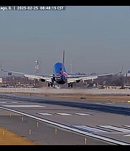 In this screengrab made from video, a Southwest Airlines plane and a private jet are seen in a near miss incident at Chicago's Midway International Airport on February 25.
Mandatory Credit:	from StreamTime Live via CNN Newsource