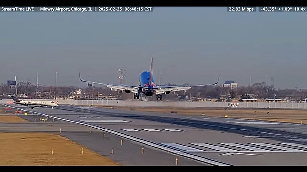 In this screengrab made from video, a Southwest Airlines plane and a private jet are seen in a near miss incident at Chicago's Midway International Airport on February 25.
Mandatory Credit:	from StreamTime Live via CNN Newsource