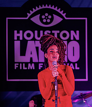 Calma Carmona during a live musical performance.