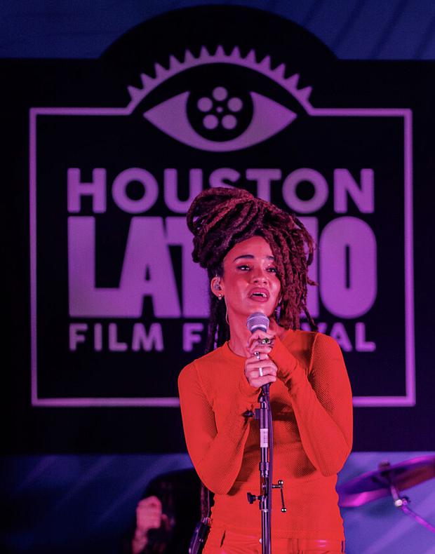 Calma Carmona during a live musical performance.