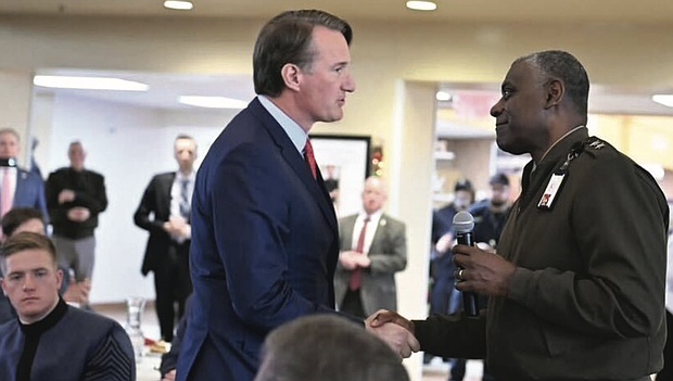 Virginia Military Institute superintendent, Retired Maj. Gen. Cedric Wins, greets Gov. Glenn Youngkin on Dec. 12, 2024.