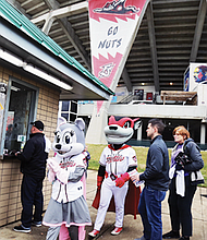 Nutzy and Nutasha pose with baseball fans.