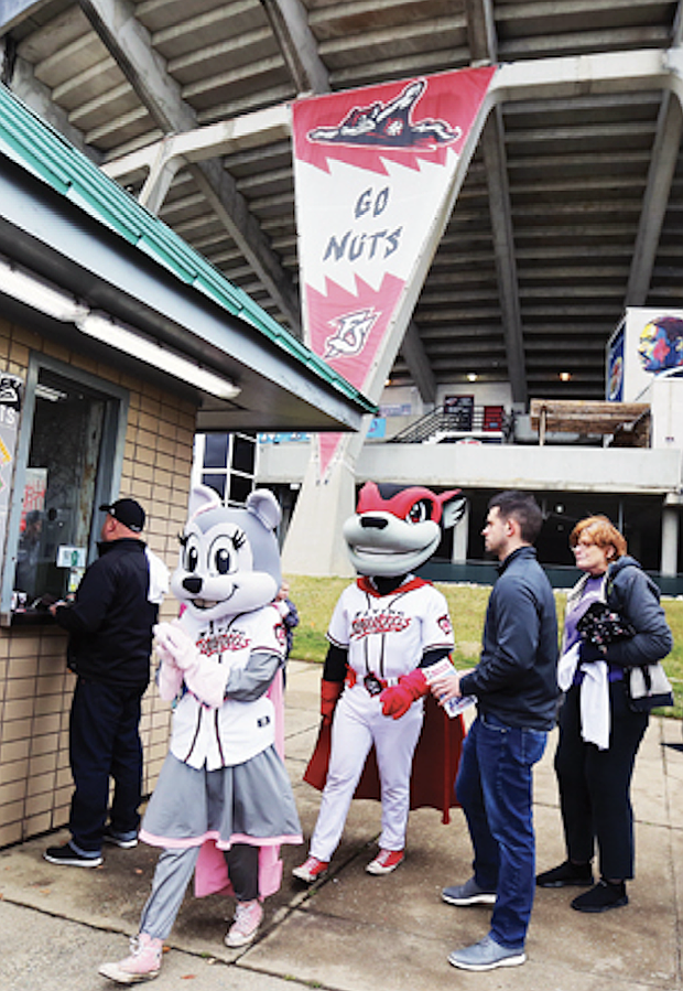 Nutzy and Nutasha pose with baseball fans.