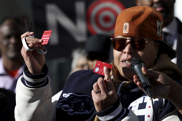 A community advocate cut a Target credit card during a news conference outside Target Corporation's headquarters on January 30, in Minneapolis, Minnesota.
Mandatory Credit:	Ellen Schmidt/AP via CNN Newsource