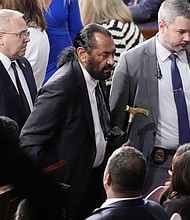 Rep. Al Green is escorted out as President Donald Trump addresses a joint session of Congress at the Capitol in Washington, DC, on March 4. House Republicans are immediately moving to punish Green for repeatedly disrupting Trump’s speech.
Mandatory Credit:	Alex Brandon/AP via CNN Newsource