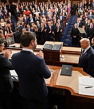 President Donald Trump is applauded by Vice President JD Vance and House Speaker Mike Johnson as he arrives to deliver his address to a joint session of Congress at the US Capitol in Washington, DC, on March 4.
Mandatory Credit:	Mandel Ngan/Pool/Getty Images via CNN Newsource