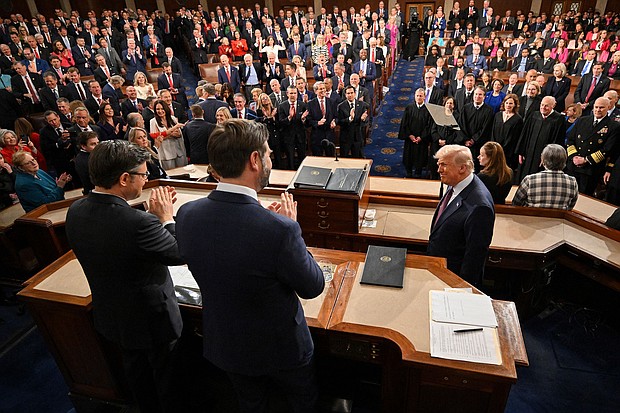 President Donald Trump is applauded by Vice President JD Vance and House Speaker Mike Johnson as he arrives to deliver his address to a joint session of Congress at the US Capitol in Washington, DC, on March 4.
Mandatory Credit:	Mandel Ngan/Pool/Getty Images via CNN Newsource