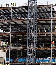 Construction workers at the VPM headquarters pause their work to observe the “March 4th
Democracy” protest March 4. The five-story, 54,000-square-foot facility at 15 E. Broad St., will
feature news and radio broadcast studios, podcast and music recording studios, offices and a
1,500-square-foot retail space.The project is scheduled for completion in 2026.
