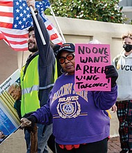 Pixie Curry joins protesters Tuesday in a march from Monroe Park to Capitol Square in Richmond.