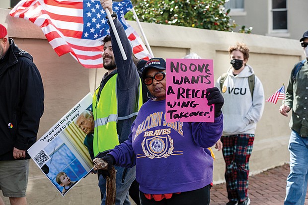 Pixie Curry joins protesters Tuesday in a march from Monroe Park to Capitol Square in Richmond.