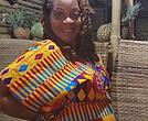 Indee Jordan stands at the Pine & Ginja Smoothie Cafe in Atimpoku, Ghana. She and her husband opened the cafe as part of their move to the Eastern Region, where they have established themselves in the local community.