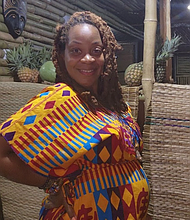 Indee Jordan stands at the Pine & Ginja Smoothie Cafe in Atimpoku, Ghana. She and her husband opened the cafe as part of their move to the Eastern Region, where they have established themselves in the local community.