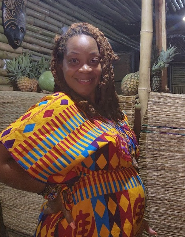 Indee Jordan stands at the Pine & Ginja Smoothie Cafe in Atimpoku, Ghana. She and her husband opened the cafe as part of their move to the Eastern Region, where they have established themselves in the local community.