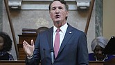 Gov. Glenn Youngkin gestures as he delivers his annual State of the Commonwealth address Jan. 13 before the General Assembly at the State Capitol.