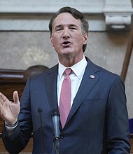 Gov. Glenn Youngkin gestures as he delivers his annual State of the Commonwealth address Jan. 13 before the General Assembly at the State Capitol.