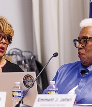 Sixth District School Board member Shonda Harris-Muhammed and 7th District School Board
member Cheryl Burke chat after voting on the budget during a Richmond School Board
meeting Tuesday, March 4, at City Hall.