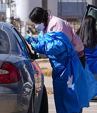 A health worker tests for measles at a mobile testing site in Texas in February. Case numbers are continuing to climb in Texas and a nearby New Mexico county.
Mandatory Credit:	Julio Cortez/AP via CNN Newsource