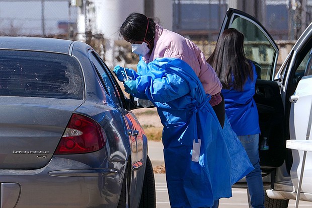 A health worker tests for measles at a mobile testing site in Texas in February. Case numbers are continuing to climb in Texas and a nearby New Mexico county.
Mandatory Credit:	Julio Cortez/AP via CNN Newsource