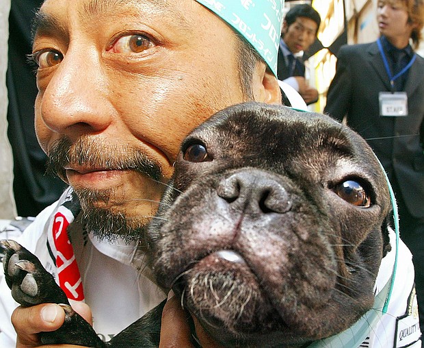 Why dogs look like their owners could shed some light on certain aspects of humans' social behaviors too, experts say.
Mandatory Credit:	Yoshikazu Tsuno/AFP/Getty Images via CNN Newsource