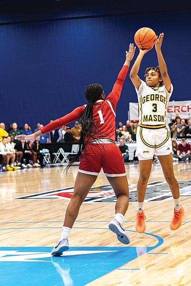 Hawks’ Laura Ziegler (4) grabs a rebound as George Mason’s defenders contest during the 2025 Atlantic 10 Women’s Basketball Championship at the Henrico Sports & Events Center.