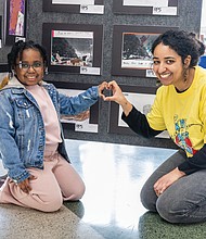 Ava Marie, 7, a student at Chimborazo Elementary School, with her art teacher Celine in front of her painting on display at the Richmond Public Schools Fine Arts Festival on Saturday, March 8.