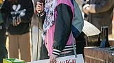 Kienan Chung, community organizer and activist, speaks to a crowd gathered at Jefferson Park on Sunday, March 2, during a rally held by Virginia’s section of the Party for Socialism and Liberation.