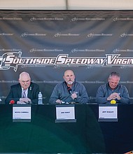 Jim Ingle, chair of the Chesterfield County Board of Supervisors (Bermuda District), speaks
during a press conference on Tuesday, March 11, where Competitive Racing Investments
LLC (CRI) and Chesterfield County officials announced a 20-year ground lease-to-purchase
agreement for Southside Speedway. At left are Clover Hill District Supervisor Jessica
Schneider and Matoaca District Supervisor Kevin Carroll. At right are Jeff Oakley, manager
and chairman of CRI, and Lin O’Neill, president of racetrack operations.