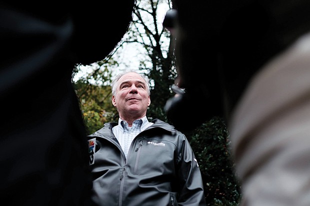 Sen. Tim Kaine, D-Va., talks to reporters after voting in Richmond recently.
