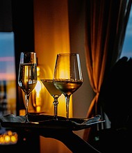 Glasses of wine are served at a rooftop bar.
Mandatory Credit:	Shuran Huang/The Washington Post/Getty Images via CNN Newsource
