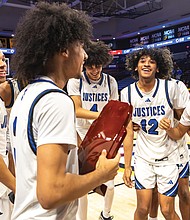 The Justices celebrate their championship victory on the court.
