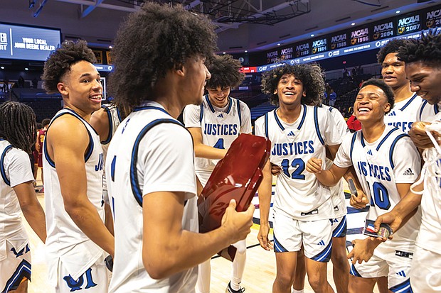 The Justices celebrate their championship victory on the court.
