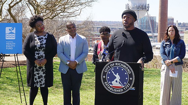 Anthony Clary speaks at a press conference after We Off the Couch was awarded a grant from the Richmond Health Equity Fund to expand its community fitness programs.