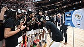 VCU players celebrate after defeating George Mason 68-63 in the Atlantic 10 Championship at Capital One Arena in Washington, D.C. The win secured the Rams an automatic bid to the 2025 NCAA Tournament, where they will face BYU in the first round.