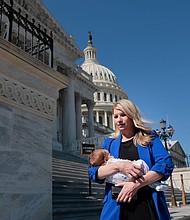 Rep. Brittany Pettersen holds her one-month old baby Sam as she departs during a series of votes at the Capitol on March 11, in Washington, DC.
Mandatory Credit:	Anna Moneymaker/Getty Images via CNN Newsource