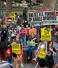Richmond residents and VCU students gathered at Monroe Park on Wednesday, March 19, to protest the resumption of Israeli airstrikes on Gaza. The demonstration, organized by the Party for Socialism and Liberation Virginia, called for an end to the conflict in Palestine and the release of Palestinian activist Mahmoud Khalil, who was arrested earlier this month by federal immigration authorities and faces deportation. (Julianne Tripp Hillian / Richmond Free Press)