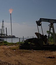 A Petroleos de Venezuela SA (PDVSA) oil pumpjack on Lake Maracaibo in Cabimas, Zulia state, Venezuela.
Mandatory Credit:	Gaby Oraa/Bloomberg/Getty Images via CNN Newsource