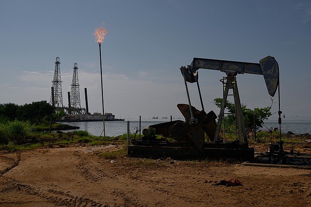 A Petroleos de Venezuela SA (PDVSA) oil pumpjack on Lake Maracaibo in Cabimas, Zulia state, Venezuela.
Mandatory Credit:	Gaby Oraa/Bloomberg/Getty Images via CNN Newsource